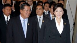 Cambodia's Prime Minister Hun Sen, left, walks with his Thai counterpart Yingluck Shinawatra as they attend ASEAN-UN Summit in Nusa Dua, Bali, Indonesia, file photo.