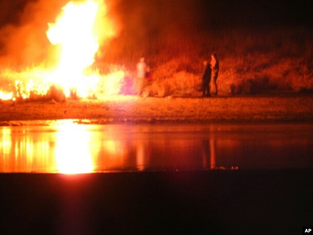 In this image provided by Morton County Sheriff’s Department, law enforcement and protesters clash near the site of the Dakota Access pipeline on Nov. 20, 2016, in Cannon Ball, N.D.