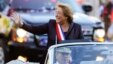 FILE - Chile's new President Michelle Bachelet waves from a car heading to La Moneda presidential palace in Santiago, March 11, 2014. 