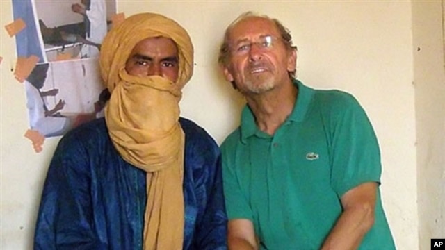 Undated handout photo with unknown dateline supplied by the Gerardmer-Tidarmene association shows Pierre Camatte (R), 61, posing with an unidentified man. Camatte was kidnapped overnight on 25 Nov 2009 in Menaka, northern Mali.
