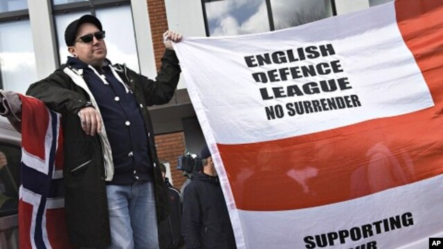 Protester hold banners as people from anti-Islamic groups from all over Europe came together March 31, 2012 in Aarhus, Denmark. 