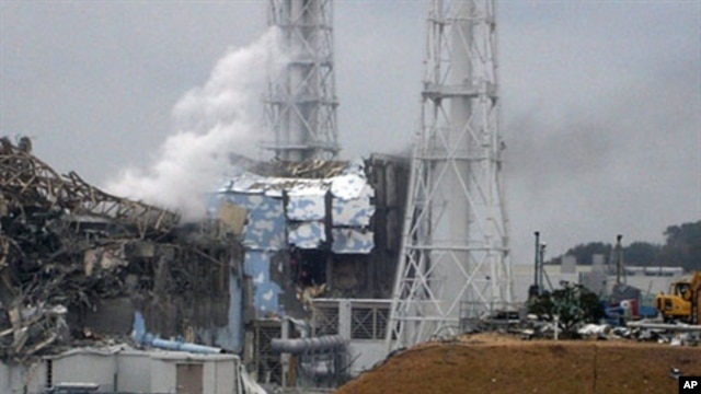 This handout picture shows the damaged third (L) and fourth reactors of the TEPCO Fukushima No.1 power plant in Fukushima, north of Tokyo, March 16, 2011