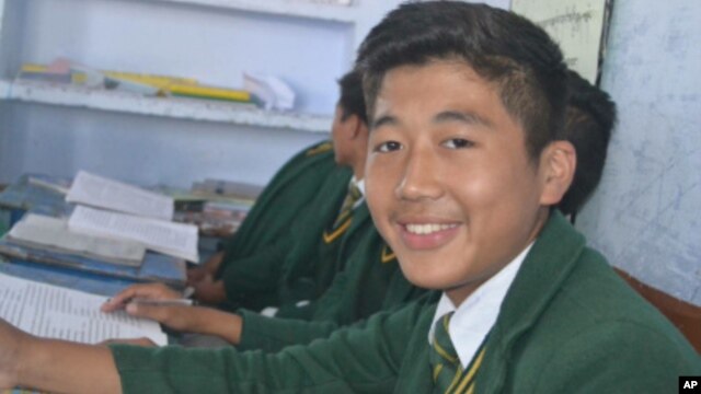 FILE - Dorje Tsering, 16, who died from a cardiac after setting himself ablaze at a housing settlement for Tibetan refugees in northern India, seen at his high school in Dehradun, undated.