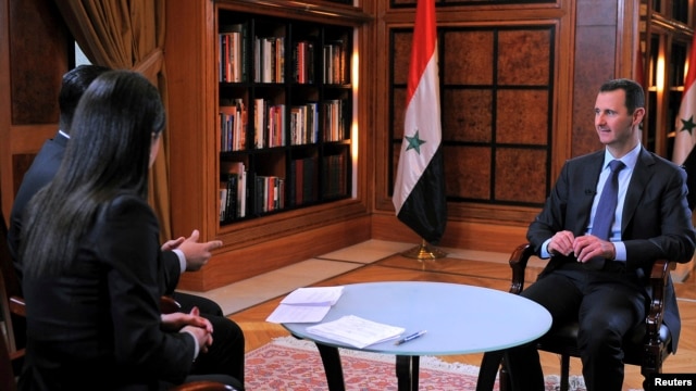 ng Assad trả lời phỏng vấn trn đi truyền hnh Al-Ikhbariya của nh nước.