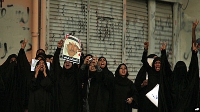 Bahraini women shout anti-government slogans in Sitra, August 31, 2011, during a demonstration shortly after the death of 14-year-old Ali Jawad Ahmad