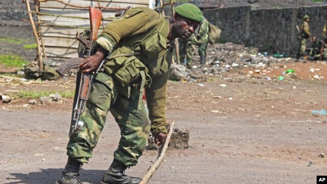 A Congolese soldier at the last  army check point in Munigi, near Goma in the DRC on Nov. 19, 2012. 