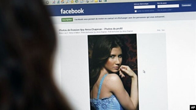 An internet user looks at a facebook page dedicated to Anna Chapman in Paris on July 23, 2010