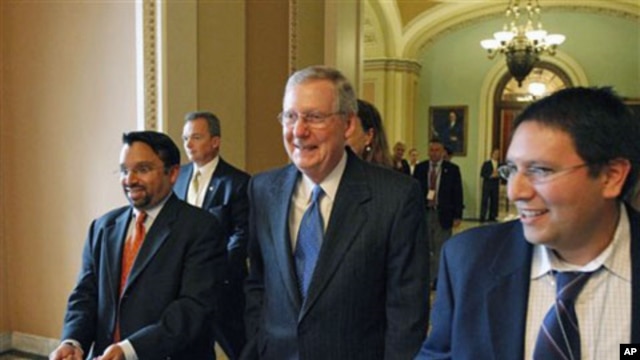 Senate Minority Leader Mitch McConnell, R-Ky., center, on Capitol Hill in Washington, 15 Nov 2010