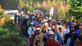 The line grows longer outside the Mutomo Primary School as crowds prepare to cast their ballots, Gatundu, Kenya, March 4, 2013.” (J. Craig/VOA)