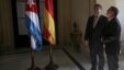 Germany's Economy Minister Sigmar Gabriel, left, and Cuba's Foreign Minister Bruno Rodriguez look at the ceiling of the building housing the foreign ministry prior to a meeting in Havana, Jan. 7, 2016.