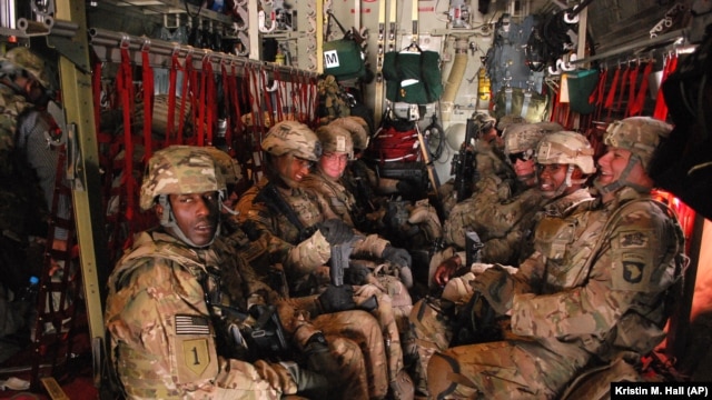 U.S. Army soldiers from the 3rd Brigade Combat Team, 101st Airborne Division sit on a plane at Forward Operating Base Salerno in Afghanistan to return home to Fort Campbell, Ky., May 21, 2013  