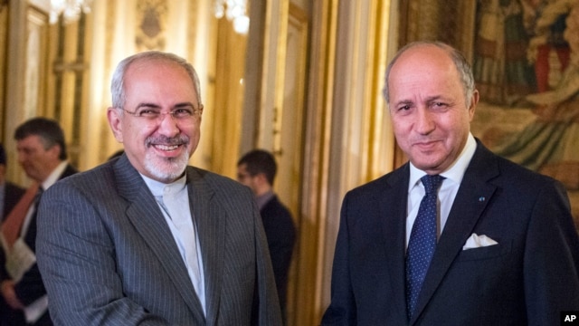 Ngoại trưởng Pháp Laurent Fabius (phải) và Ngoại trưởng Iran Jawad Zarif