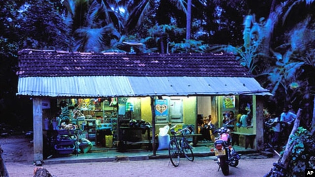 Sir Lankan village shop at dusk lit by solar panels -  Nanotechnology could help make solar cells more  accessible, efficient and affordable