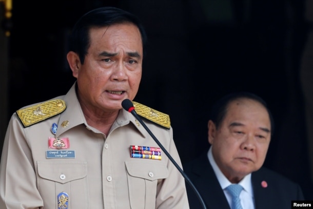 Thailand's Prime Minister Prayuth Chan-ocha speaks during a news conference after his meeting with National Security Council as Deputy Prime Minister and Defence Minister Prawit Wongsuwan looks on at Government House in Bangkok, Aug. 15, 2016.