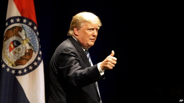 Republican presidential candidate Donald Trump acknowledges applauds from the crowd after speaking during a campaign rally, March 11, 2016.