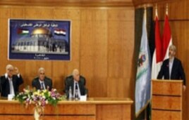 The Damascus-based leader of Hamas Khaled Mashaal, right, gives a speech as Palestinian President Mahmoud Abbas, left, sits next to Egypt's intelligence chief Murad Mewafi, 2nd left, during the reconciliation meeting in Cairo, Egypt, May 4, 2011