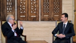 In this photo released by the Syrian official news agency SANA, Syrian President Bashar al-Assad, right, meets with UN Arab League deputy to Syria, Lakhdar Brahimi in Damascus, Syria, Dec. 24, 2012.