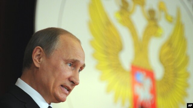  Russia's President Vladimir Putin addresses Russian Ambassadors during their meeting in the Foreign Ministry, in Moscow, July 9, 2012. 