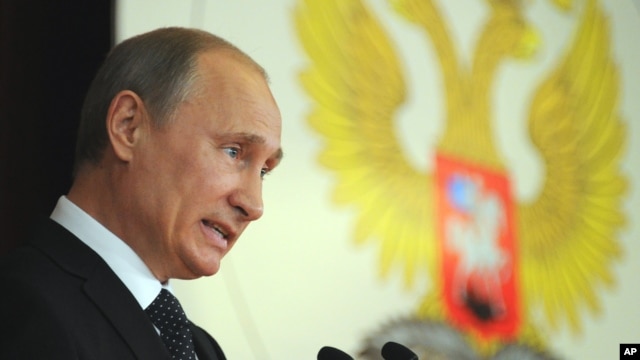  Russia's President Vladimir Putin addresses Russian Ambassadors during their meeting in the Foreign Ministry, in Moscow, July 9, 2012. 