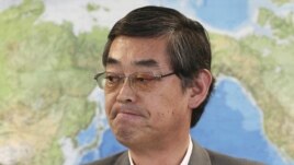 Japanese Foreign Ministry's Press Secretary Yutaka Yokoi listens to a reporter's question during a regular news conference at the Foreign Ministry in Tokyo, June 29, 2012.