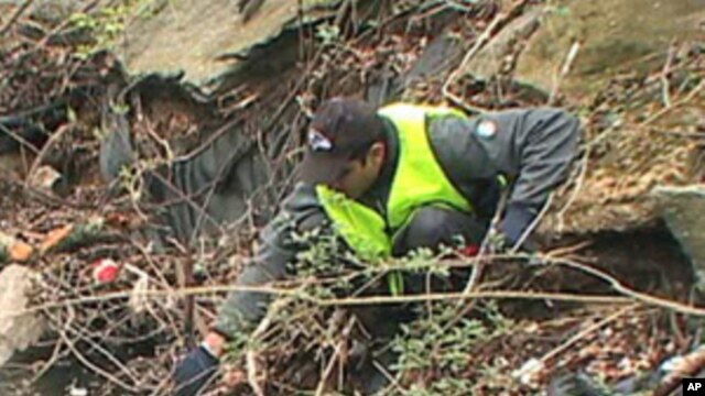 A volunteer removes trash from Boiling Brook in Maryland.
