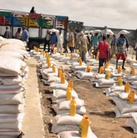 Relief workers prepare to distribute food-aid rations at a camp for the internally displaced in Mogadishu.