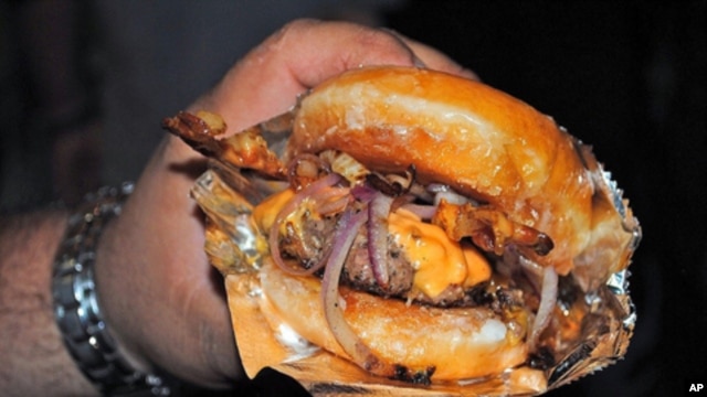 Our man Baragona's reaction to this photo of a Krisy Kreme Burger (bacon cheeseburger with two doughnuts forming the bun): I'm speechless. And a little nauseous.