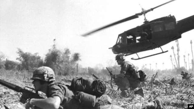 A U.S. helicopter climbs skyward after discharging a load of infantrymen in Vietnam.