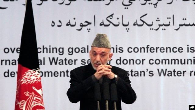 Afghan President Hamid Karzai gestures, as he speaks during a conference about water management in Kabul, Afghanistan, Tuesday, Jan. 29, 2013.