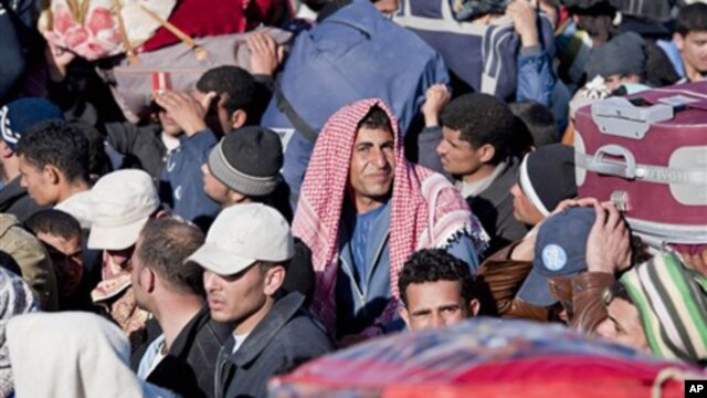 Egyptian, Tunisian and Libyan refugees in Ras Ajdir at the Tunisia-Libya border, Tuesday, March 1, 2011