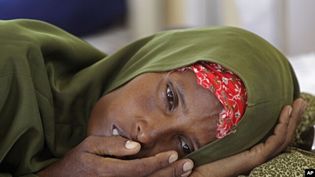 A malnourished woman lies in a field hospital of the International Rescue Committee, IRC, in the town of  Dadaab, Kenya, (File).