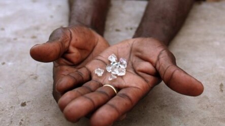 An illegal diamond dealer from Zimbabwe displays diamonds for sale in Manica, near the border with Zimbabwe. (file)