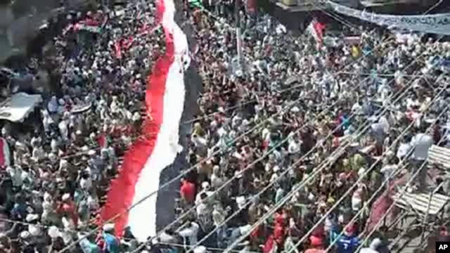 An image taken from a video uploaded on YouTube shows Syrian anti-government demonstrators marching in the coastal city of Latakia on August 12, 2011 (AFP cannot independently verify the content of this video.)