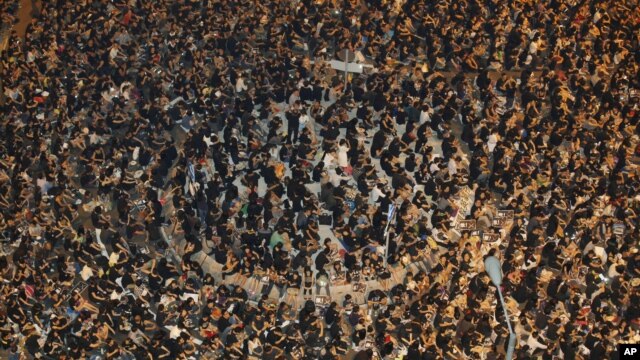 Thousands of protesters turn out outside government headquarters in Hong Kong, September 7, 2012, to protest against the government's plan to introduce a new subject "Moral and National Education" into a new curriculum. 