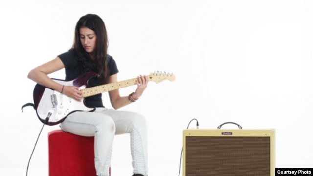 Natasha Meister with her beloved electric guitar, the first woman in Africa to be endorsed by Fender guitars(Courtesy Natasha Meister)