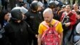 Police stand guard as gay rights activists stage a march in Kyiv May 25, 2013.