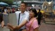 Asian tourists takes a "selfie" in front of the Erawan Shrine in Bangkok, Thailand, Oct. 22, 2015.
