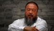 Chinese dissident artist Ai Weiwei sits on a chair in the courtyard of his studio, in Beijing, June 20, 2012.