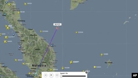 This screengrab from flightradar24.com shows the last reported position of Malaysian Airlines flight MH370 မေလးရွားေလေၾကာင္းလိုင္း ပ်ံသန္းရာလမ္းေၾကာင္းနဲ႔ ေရဒါက ေပ်ာက္သြားတဲ့ ေနာက္ဆံုးေနရာ။