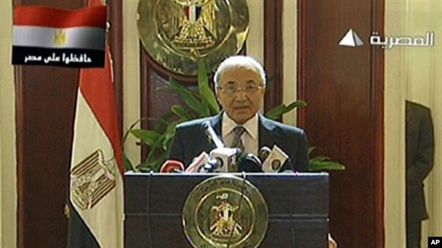 Egyptian state television Al-Masriya shows new Egyptian Prime Minister Ahmed Shafiq holding a press conference in Cairo, February 3, 2011