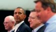 U.S. President Barack Obama glances at Britain's Prime Minister David Cameron (R) during a news conference with European Council President Herman Van Rompuy (L) and European Commission President Jose Manuel Barroso at the G8 summit in Enniskillen, Norther