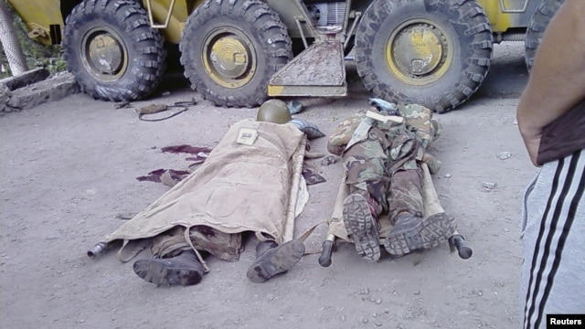 Bodies of government soldiers lie on the ground in the town of Khorog, capital of the autonomous region of Gorno-Badakhshan, in this undated handout picture received by Reuters on July 26, 2012. 