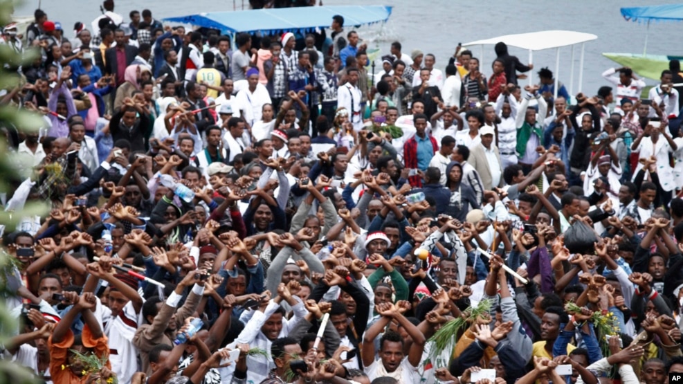 FILE - Ethiopians chant slogans against the government during their march in Bishoftu, Oct. 2, 2016. Dozens of people in the Oromia region were killed that day in a stampede when police tried to disrupt an anti-government protest amid a massive religious festival.