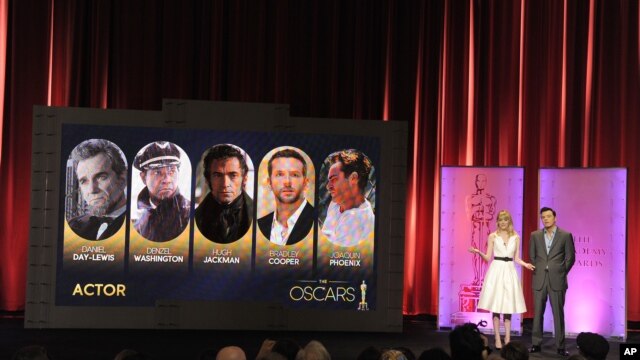 Actress Emma Stone and 2013 Oscar host Seth MacFarlane present the 85th Academy Awards nominations for Best Actor, January 10, 2012, in Beverly Hills, Calif. 