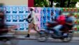 A wall is blanketed with campaign posters promoting electoral candidates, in Port-au-Prince, Haiti, Oct. 7, 2015. 