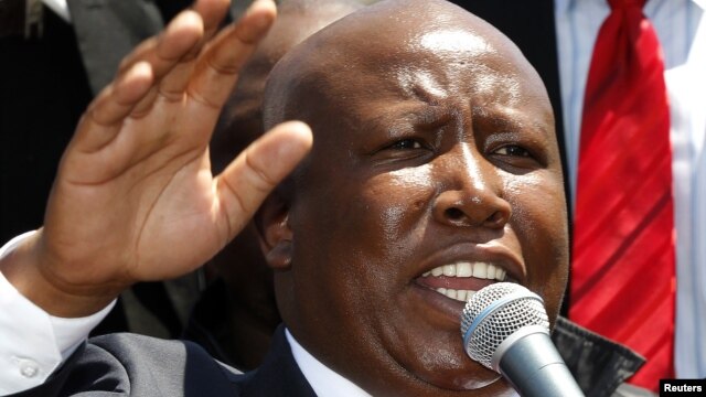 South African former African National Congress (ANC) Youth League leader Julius Malema addresses his supporters after his court appearance in Polokwane, South Africa, September 26, 2012.