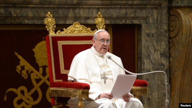 Newly elected Pope Francis I, Cardinal Jorge Mario Bergoglio of Argentina, meets cardinals in the Clementine Hall in a picture released by Osservatore Romano at the Vatican, March 15, 2013. 