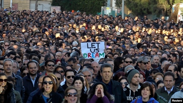 Thousands of bank employees march to the parliament during a protest in Nicosia Mar. 23, 2013.