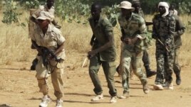 Members of a Malian pro-government militia operating in government-controlled areas take part in a training session at their base in Sevare, about 600 kilometers northeast of the capital Bamako, Mali, November 12, 2012.