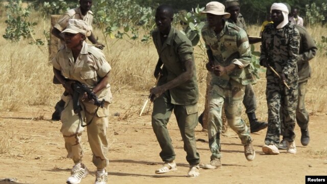 Members of a Malian pro-government militia operating in government-controlled areas take part in a training session at their base in Sevare, about 600 kilometers northeast of the capital Bamako, Mali, November 12, 2012.